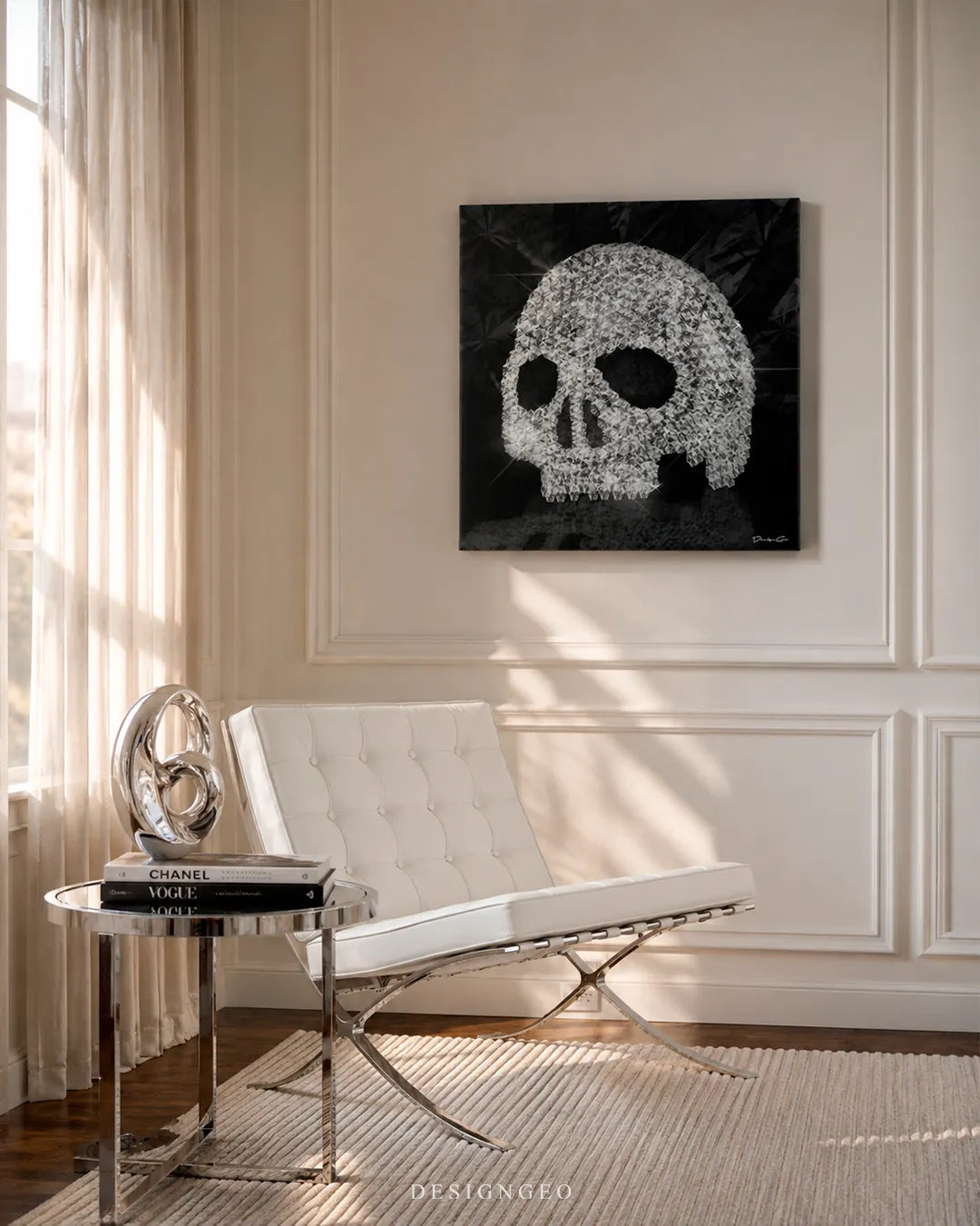 Modern luxury living room setup featuring a white leather lounge chair and a square canvas print of a glowing diamond-encrusted skull mounted on a bright wall