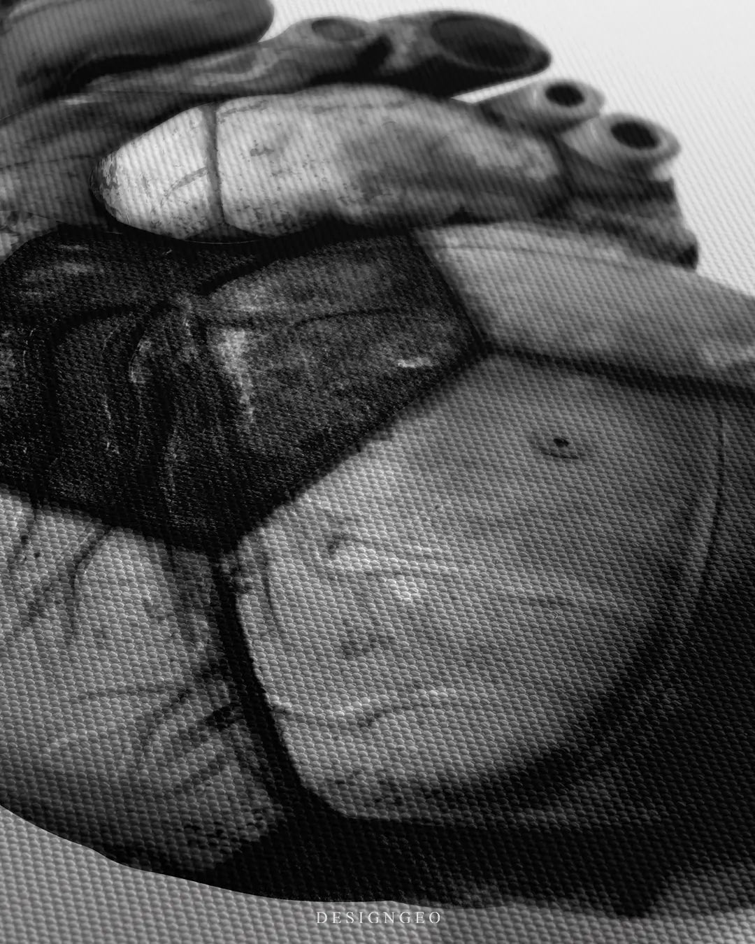 Close-up of minimalist sports wall art featuring a heart shape with a realistic black and white soccer ball leather texture on a clean white background