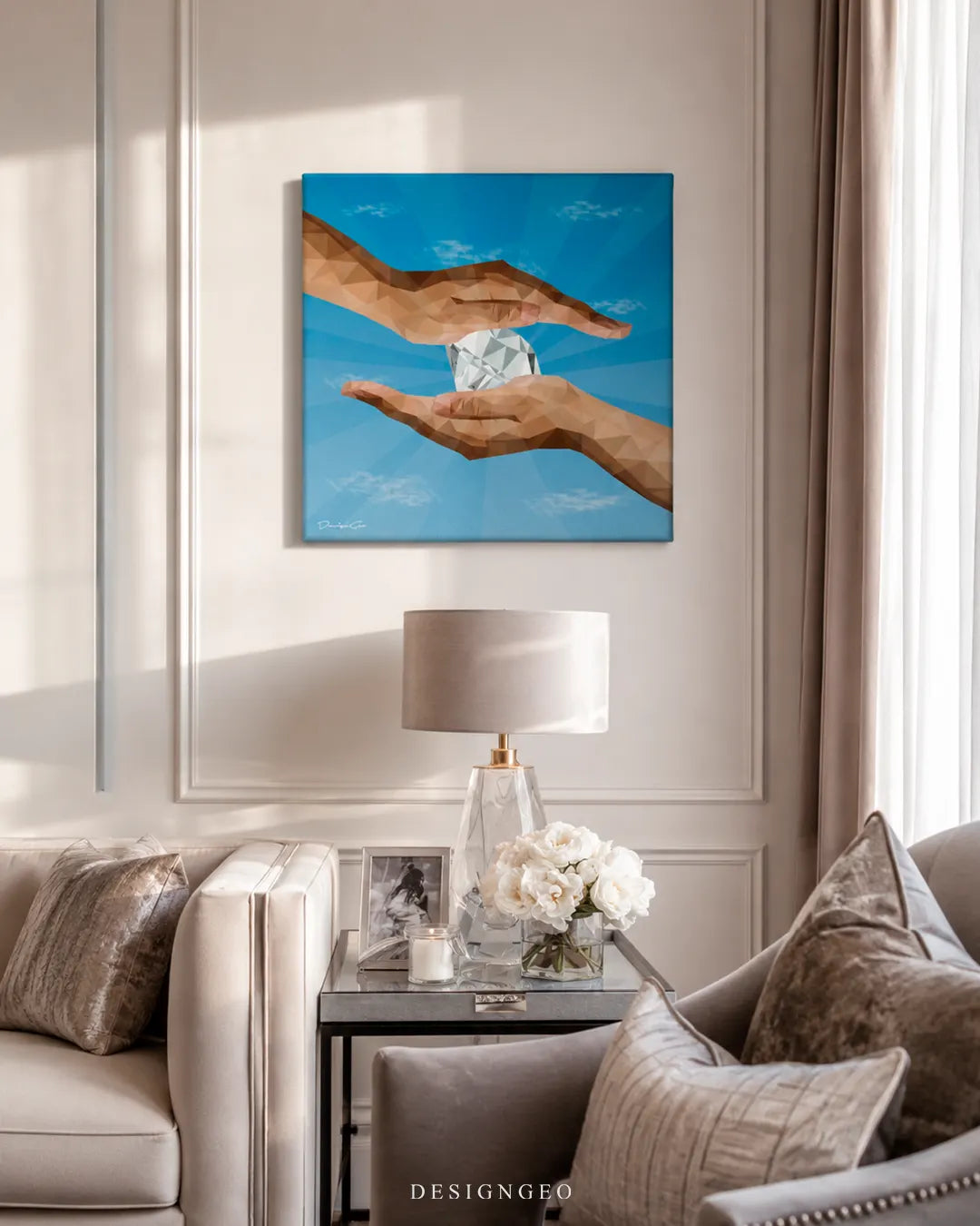Square The Diamantaire canvas print mounted on a beige wainscoted wall above a glass side table with a crystal lamp, white roses, and velvet armchairs
