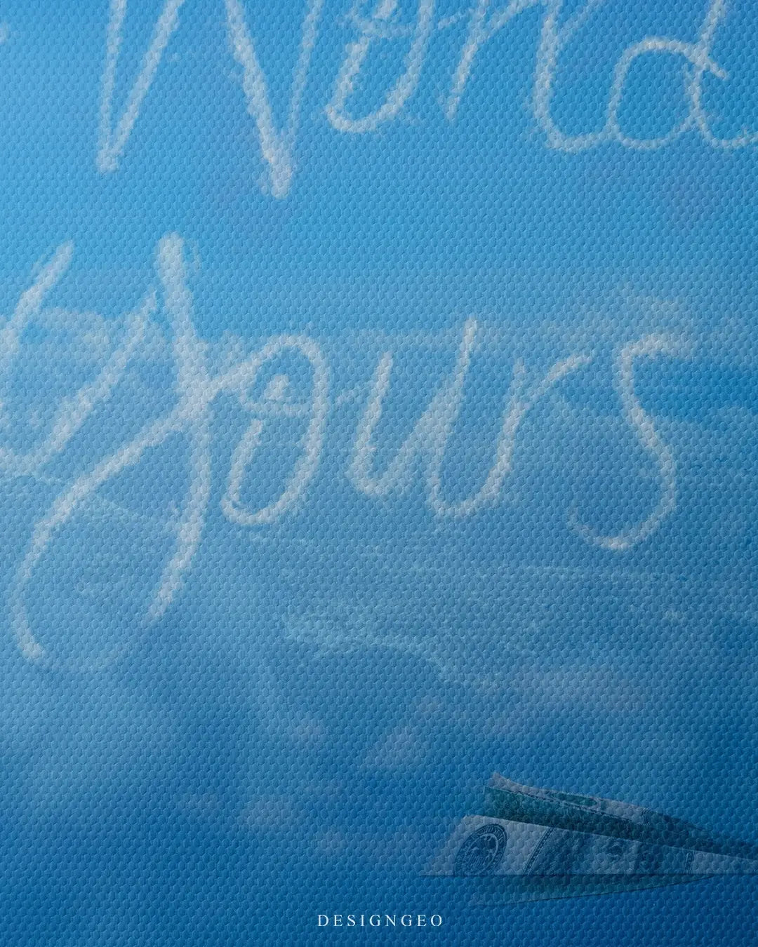 Detailed view of the "The World is Yours" cloud art, showcasing the soft textures of the cloud typography and the vibrant, airy aesthetic of the minimalist canvas
