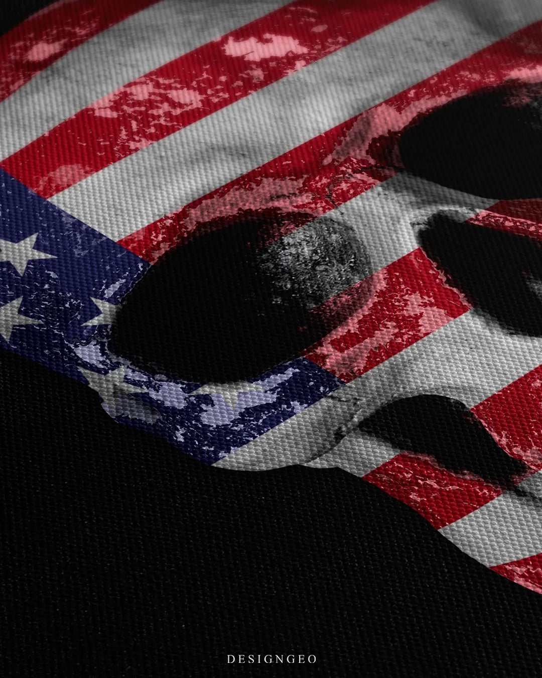 Angled detailed macro texture of woven canvas print showing American flag skull stars and stripes artwork on dark background
