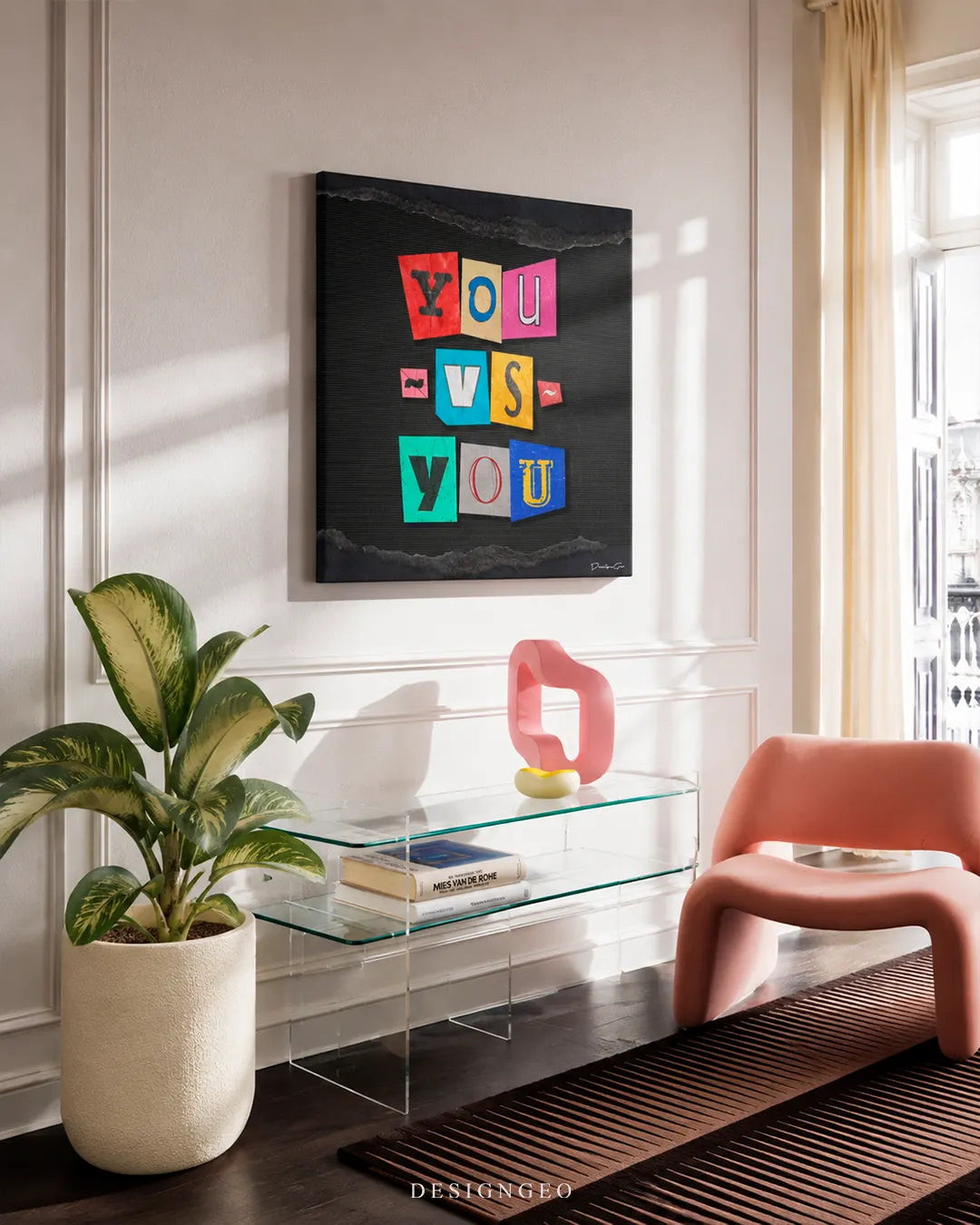 Modern interior living room displaying a square canvas print with the phrase YOU VS YOU in colorful ransom note cutout letters mounted on a bright wall