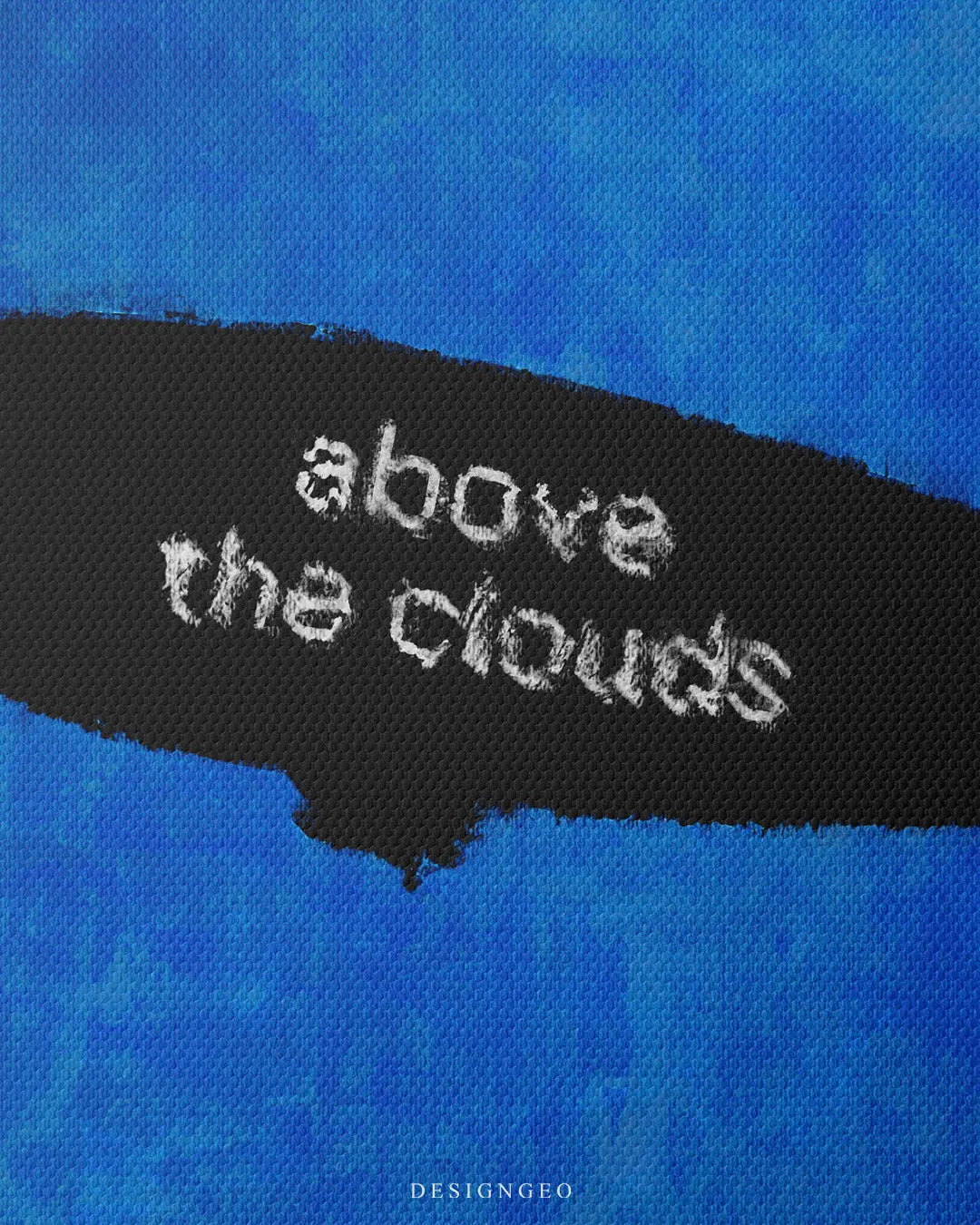 Close up shot of square blue canvas print showing white stencil typography ABOVE THE CLOUDS inside a black zeppelin airship silhouette with detailed fabric texture