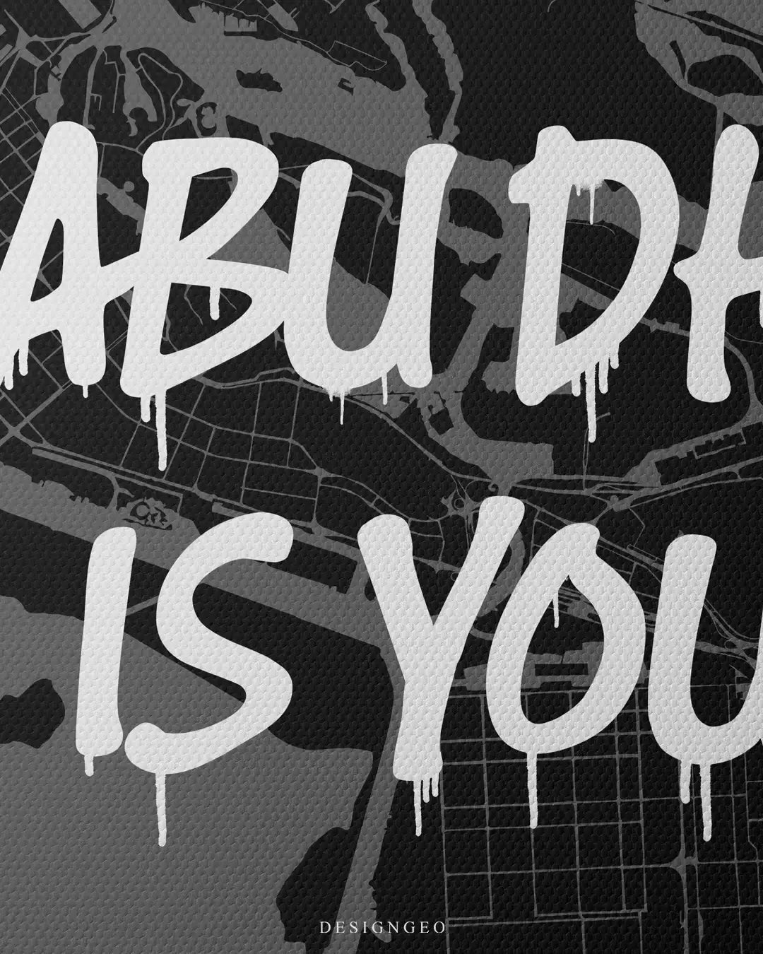 Close-up of Emirati luxury style wall art featuring a detailed Abu Dhabi city map layout with the motivational phrase "Abu Dhabi is Yours" in bold white graffiti typography on a dark background