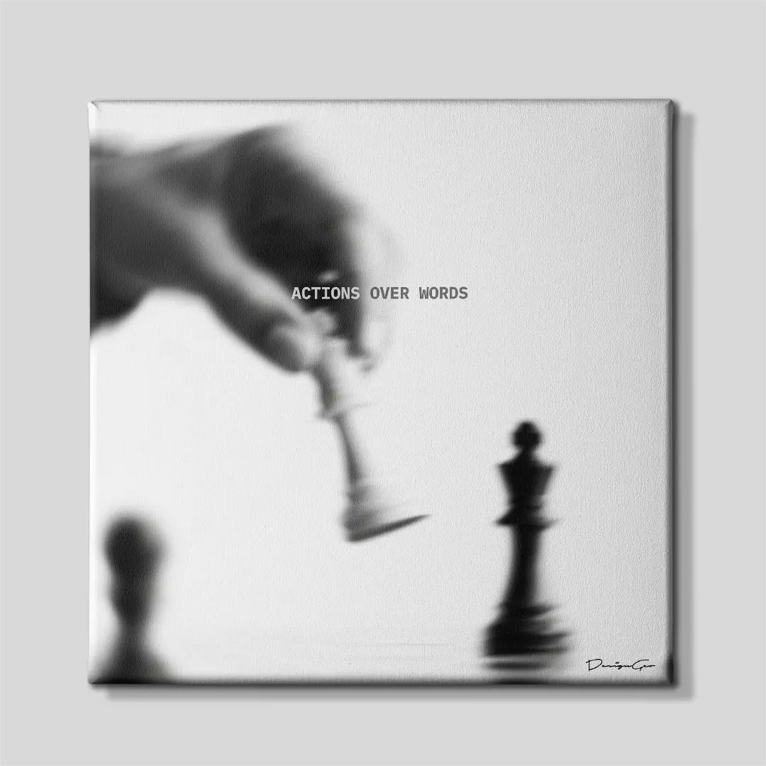 Black and white square motivational canvas wall art featuring a blurred hand moving a chess piece toward a king under quote Actions Over Words 0.75 inch thin wrap