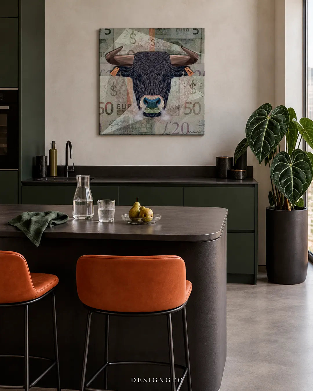 Modern luxury kitchen interior featuring a square canvas print of a majestic black Angus bull head over international currency notes mounted on a light wall above dark green cabinets
