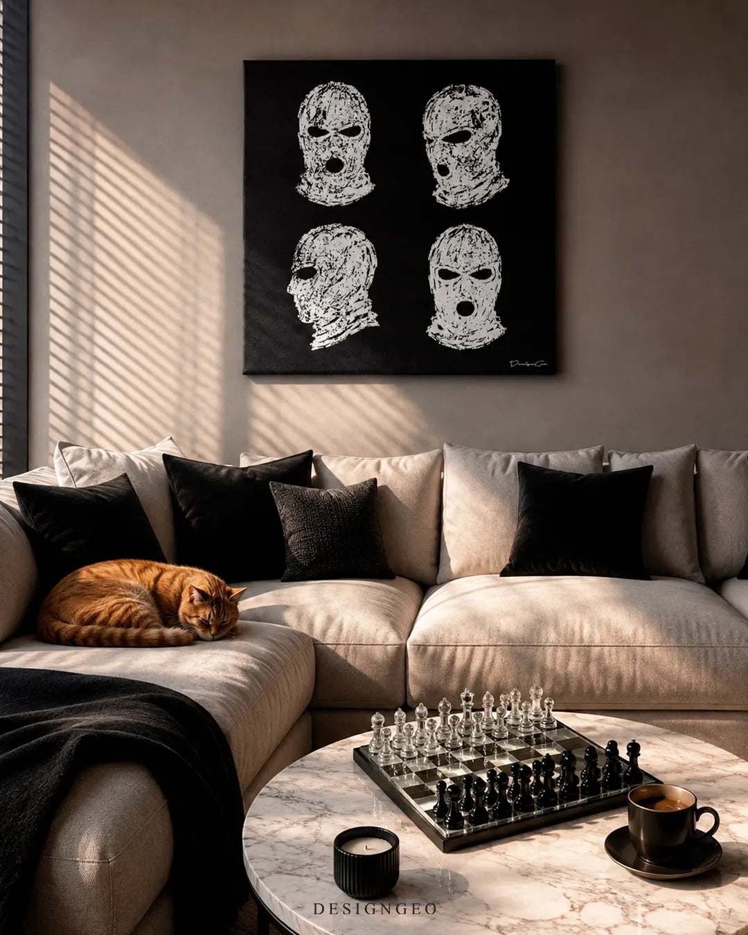 Square balaclavas grid canvas print mounted on a greige wall above a cream sectional sofa with an orange tabby cat, marble coffee table with a glass chessboard, candle, and espresso cup