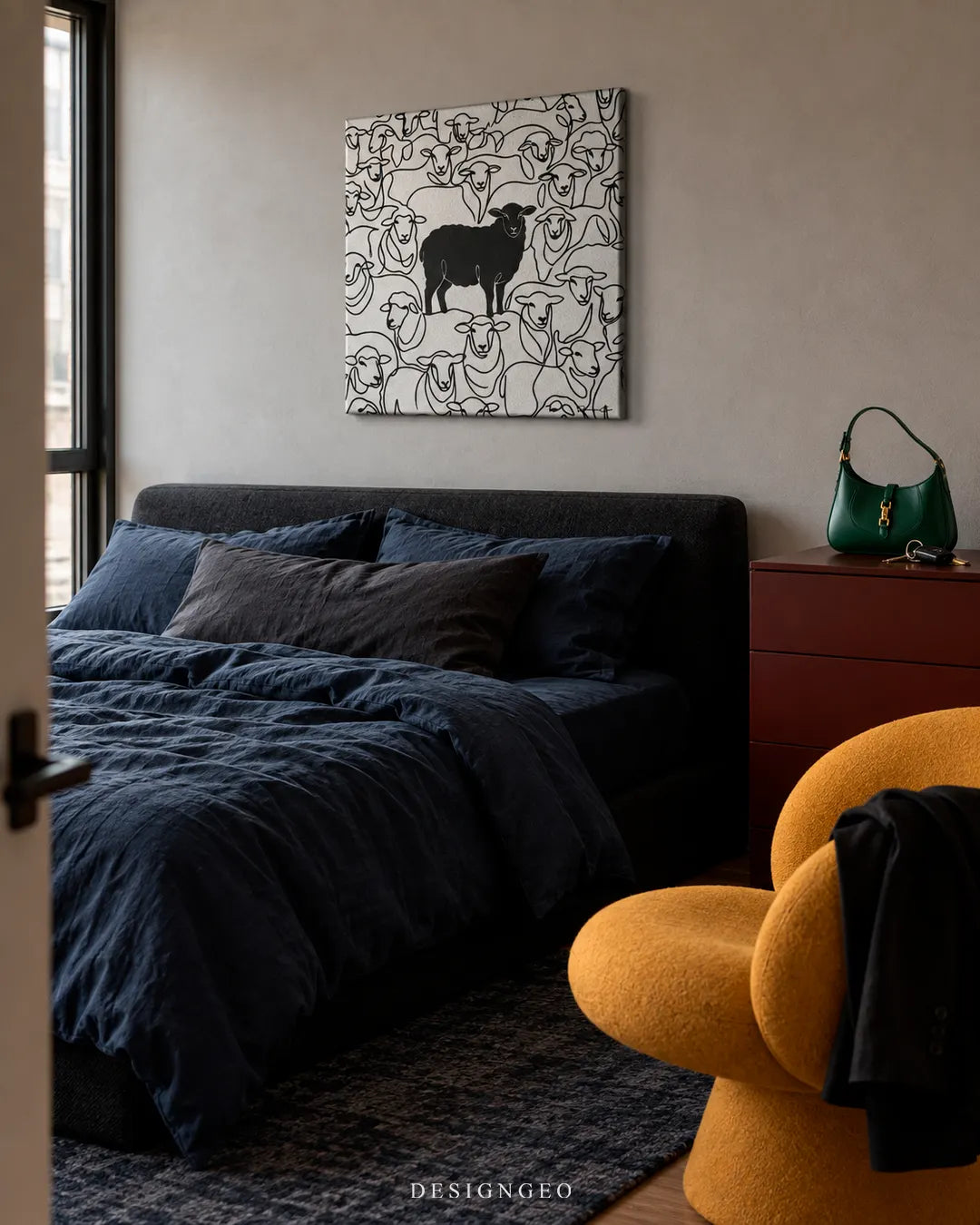 Modern luxury bedroom decor featuring a square canvas print of a solid black sheep standing out among white line art sheep mounted on a grey wall above a navy blue bed