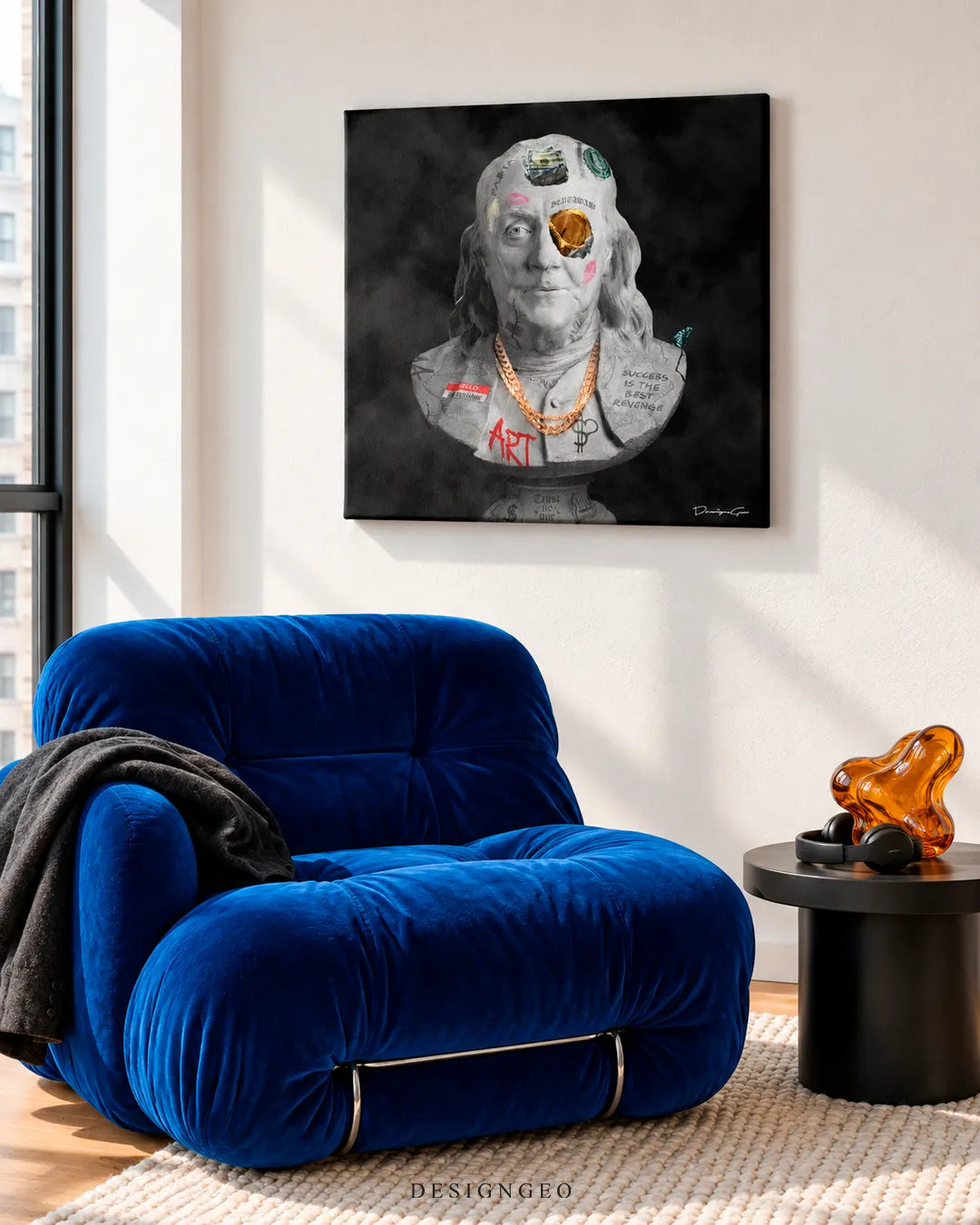 Modern luxury living room featuring a square canvas print of a Benjamin Franklin bust with street art graffiti and a gold chain mounted above a plush royal blue armchair