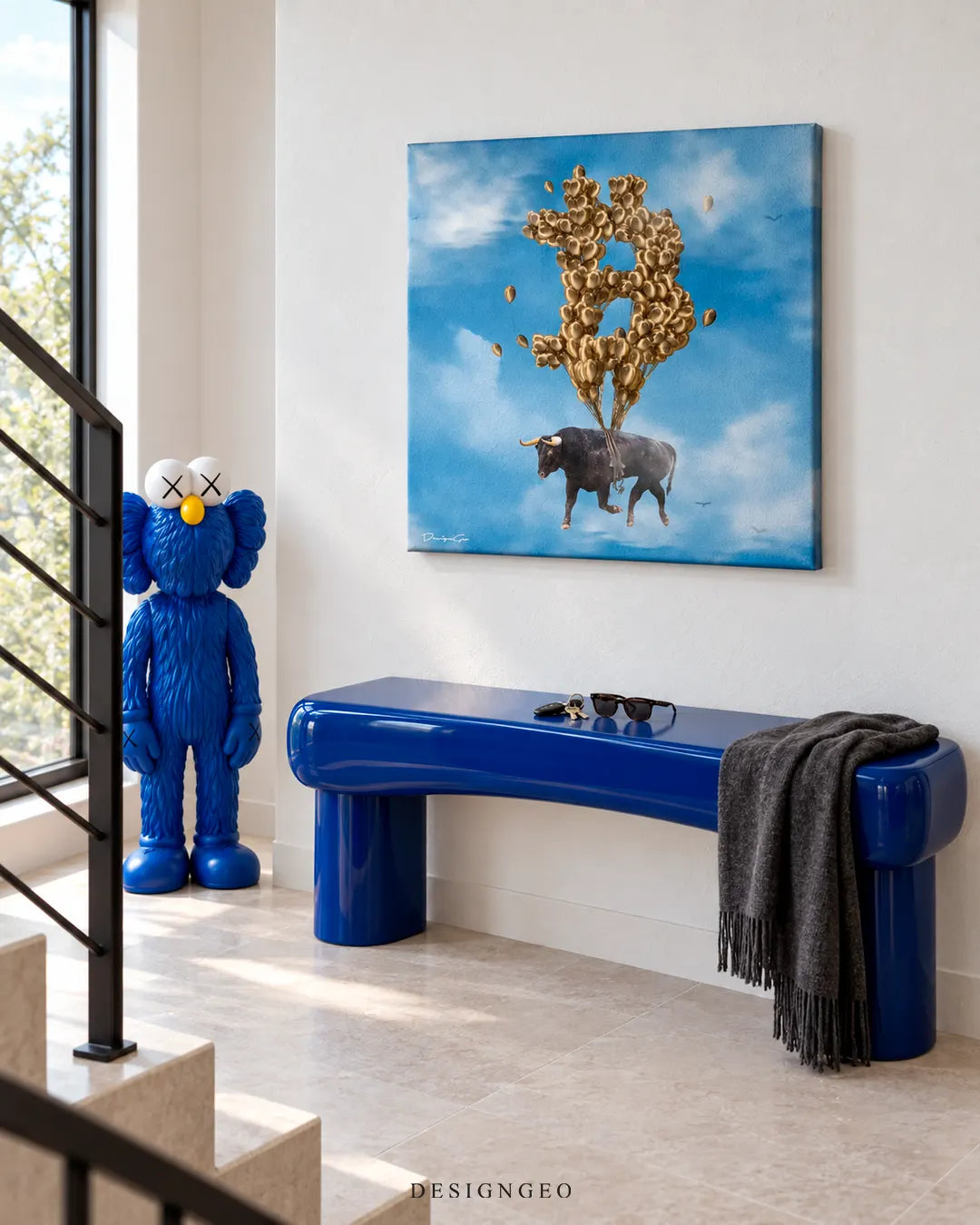 Modern luxury hallway featuring a square canvas print of a black bull flying with gold Bitcoin balloons mounted above a blue bench next to a modern art figure