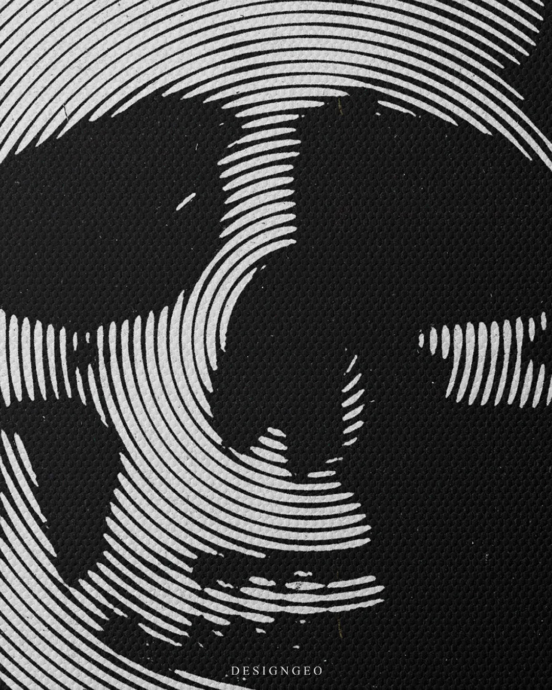 Close-up shot showing detailed curved white line art creating the eye sockets, nasal cavity, and jawline of a human skull print