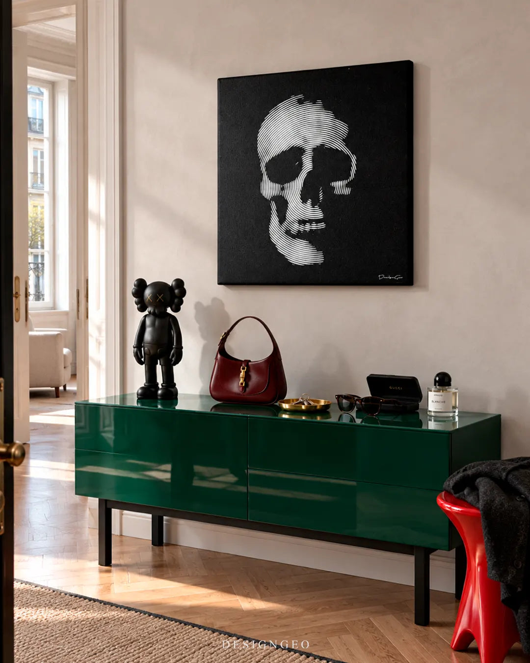 Modern luxury hallway featuring a square skull canvas print of a black and white skull made of curved lines mounted above a glossy green sideboard