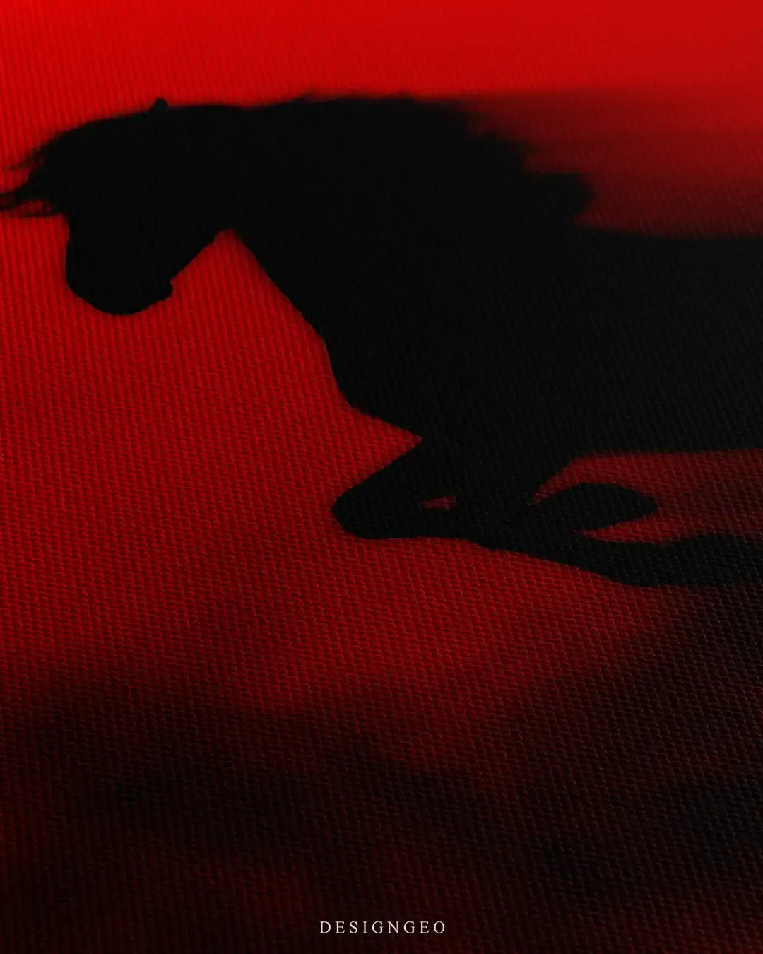 Detailed view of the black horse canvas art, showcasing the fine canvas texture and subtle dark shadow gradients blending into the vibrant red backdrop