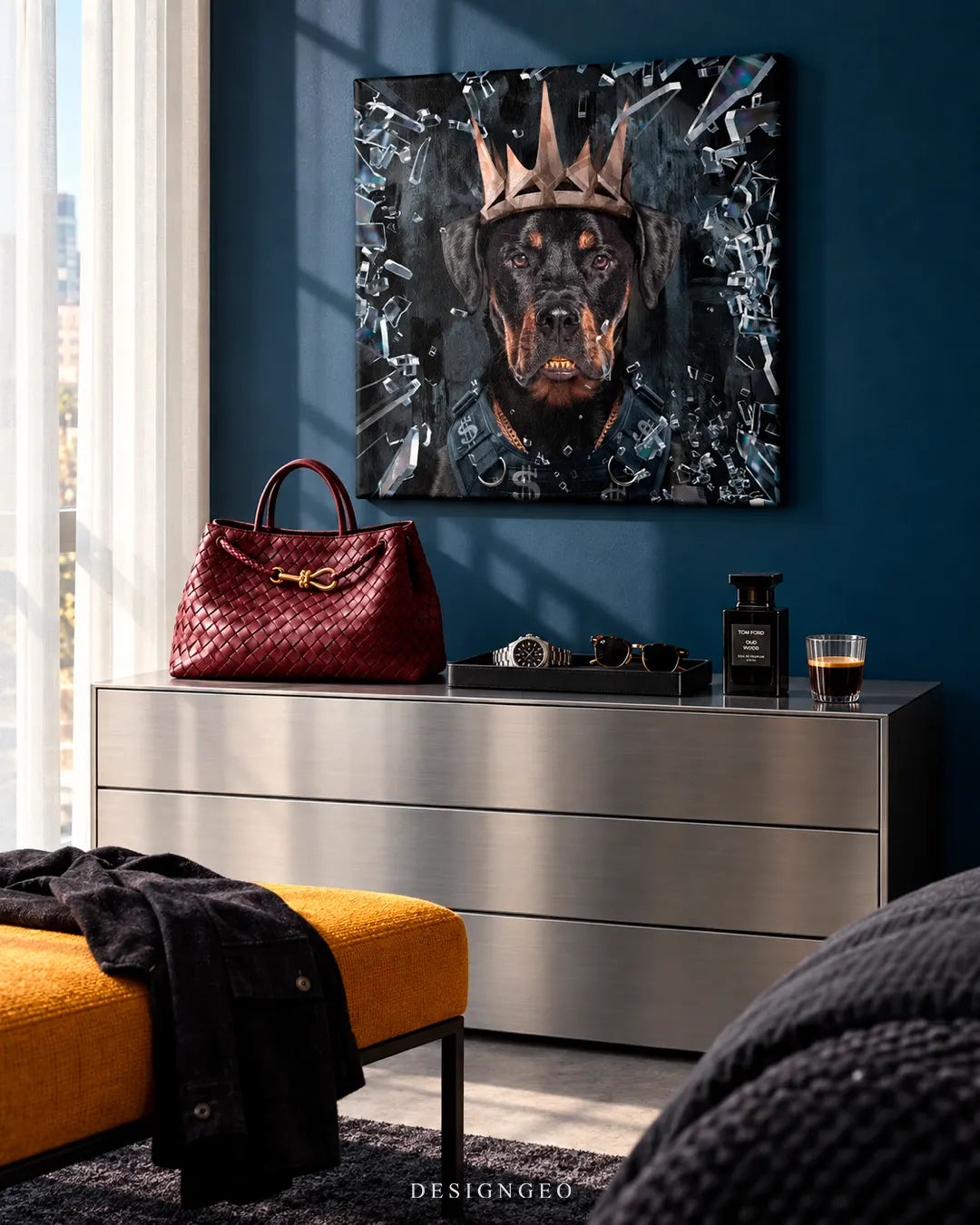 Modern luxury bedroom featuring a square canvas print of a rottweiler wearing a crown and bulletproof vest mounted on a dark teal wall above a brushed metal credenza