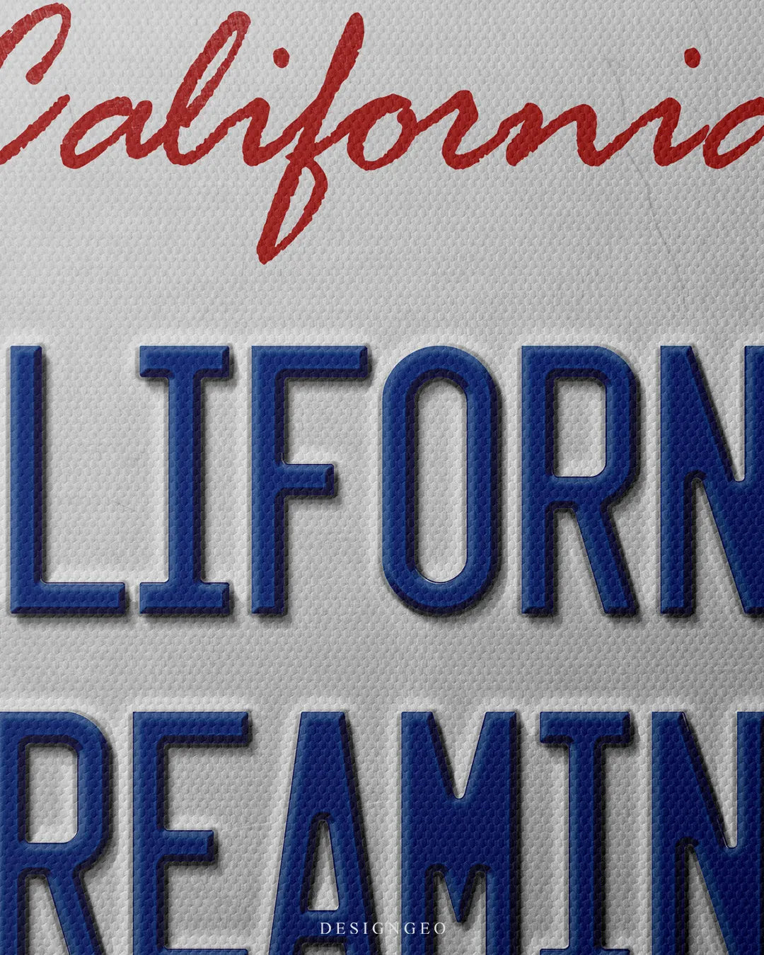 Medium shot showing red script California title above blue embossed CALIFORNIA DREAMING lettering on a metal license plate background