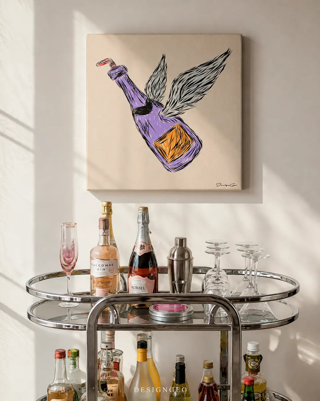 Square beige flying champagne canvas print mounted on a white wall above a chrome bar cart stocked with champagne bottles, gin, glass flutes, and a cocktail shaker