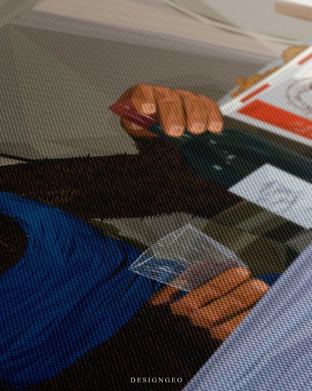 Angled macro view of a canvas print showing fine texture detail of a chimpanzee holding a wine bottle and glass in a private jet cabin