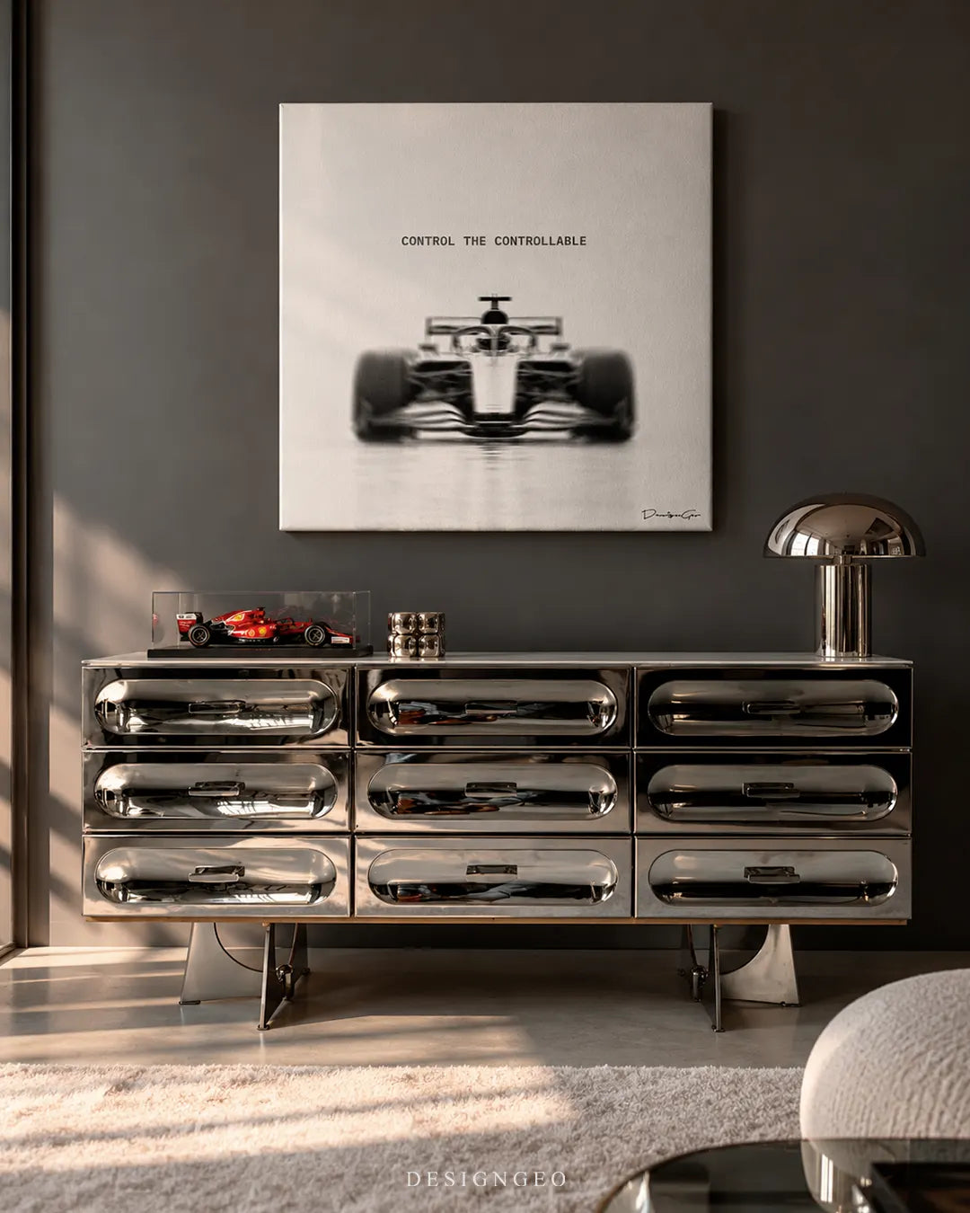 Control The Controllable Formula race car square canvas wall art mounted on dark gray wall above chrome metallic credenza with diecast Ferrari F1 model 0.75 inch thin wrap