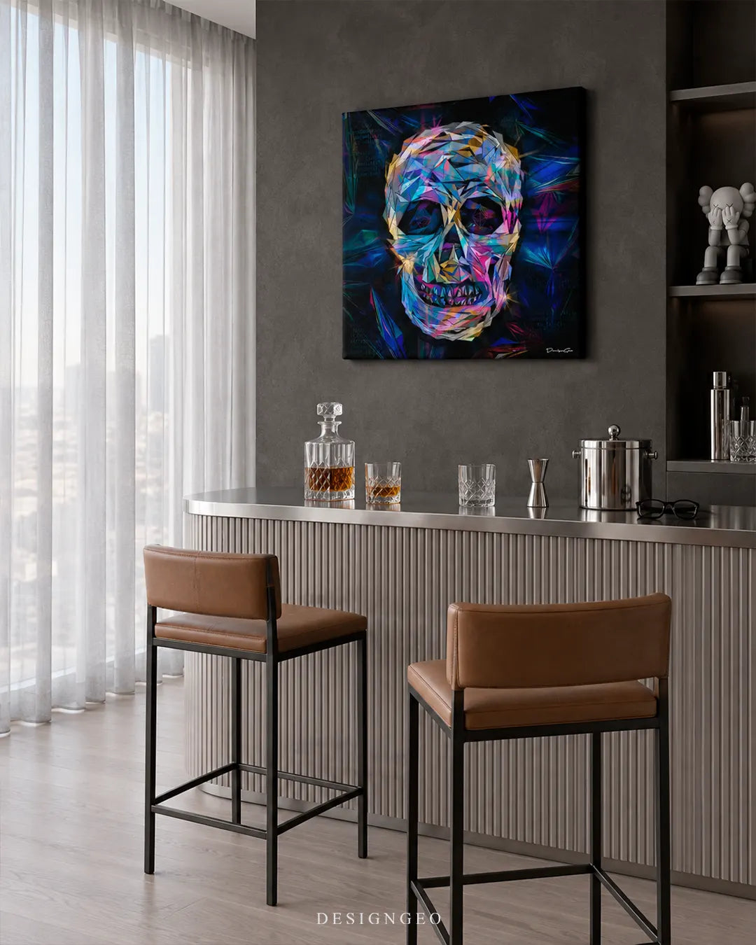 Square canvas print of a geometric colorful crystal skull portrait mounted on a dark textured wall in a modern home bar setting above leather stools
