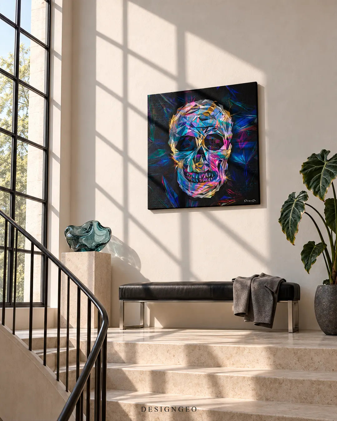Square canvas print featuring a vibrant geometric crystal skull hanging on a cream wall in a sunlit modern entryway above a black leather bench