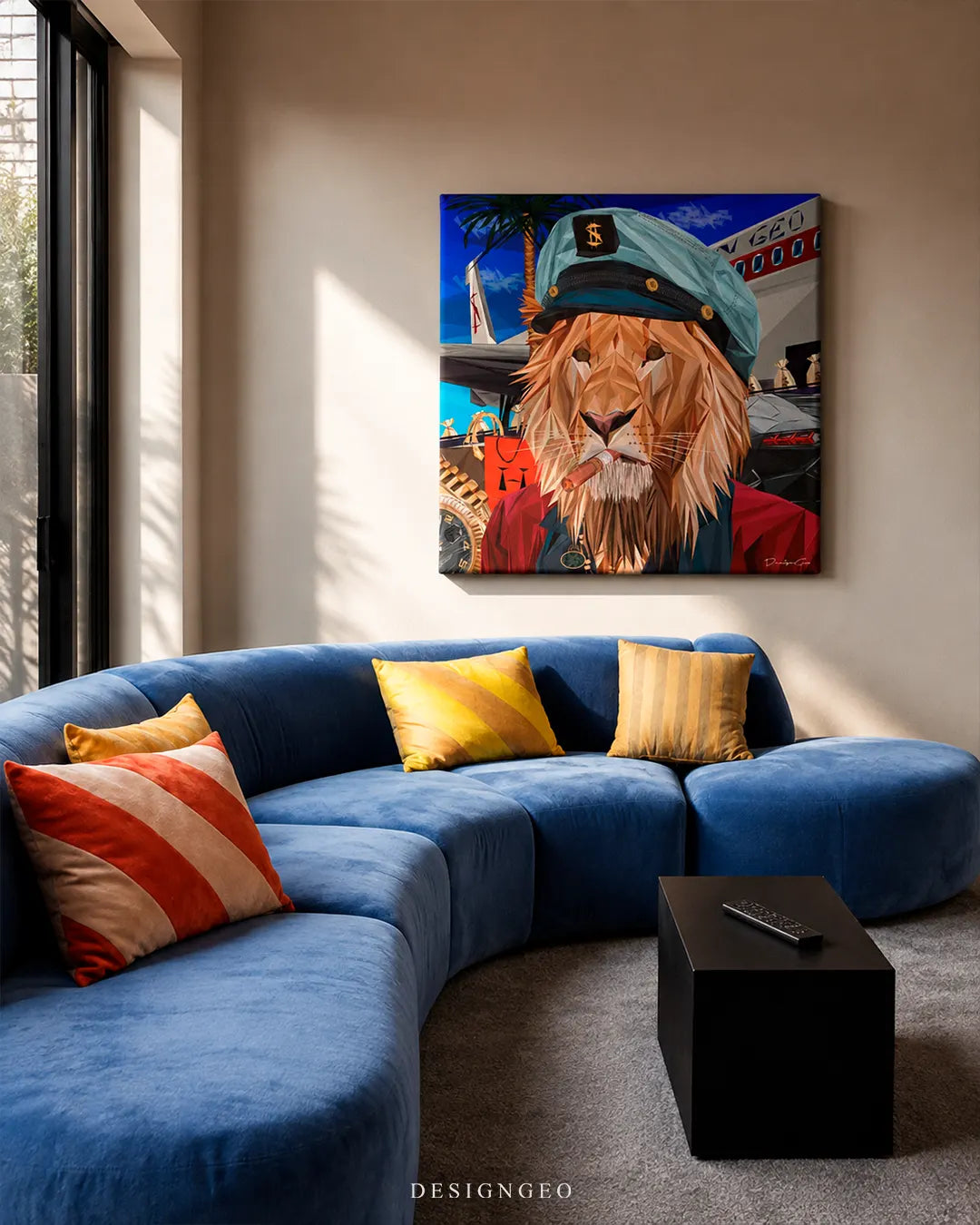Square lion captain canvas wall art displayed on a beige wall above a curved blue sofa with colorful accent pillows in a modern living room