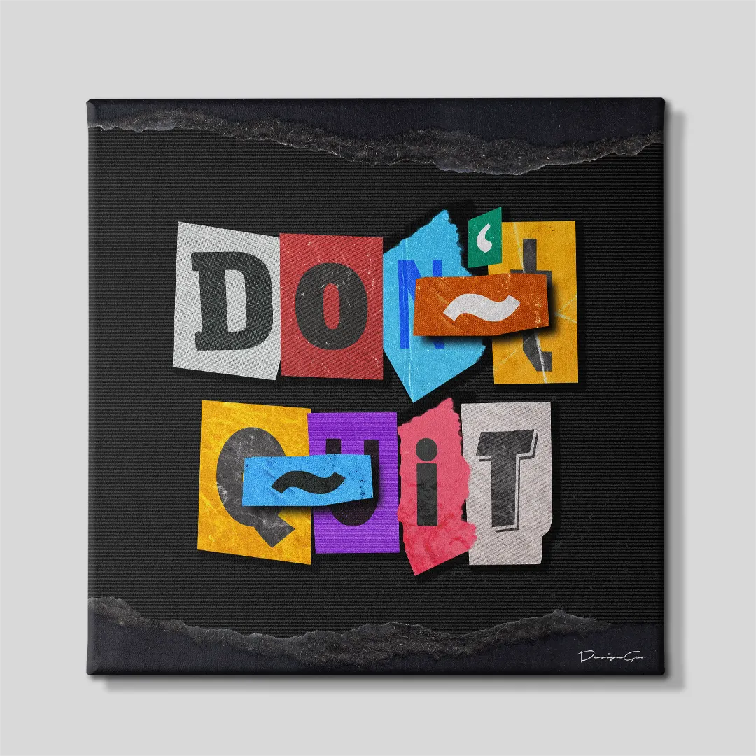 Front view of a square black canvas print featuring a magazine cutout collage spelling Don't Quit with paper scraps covering letters to also read Do It