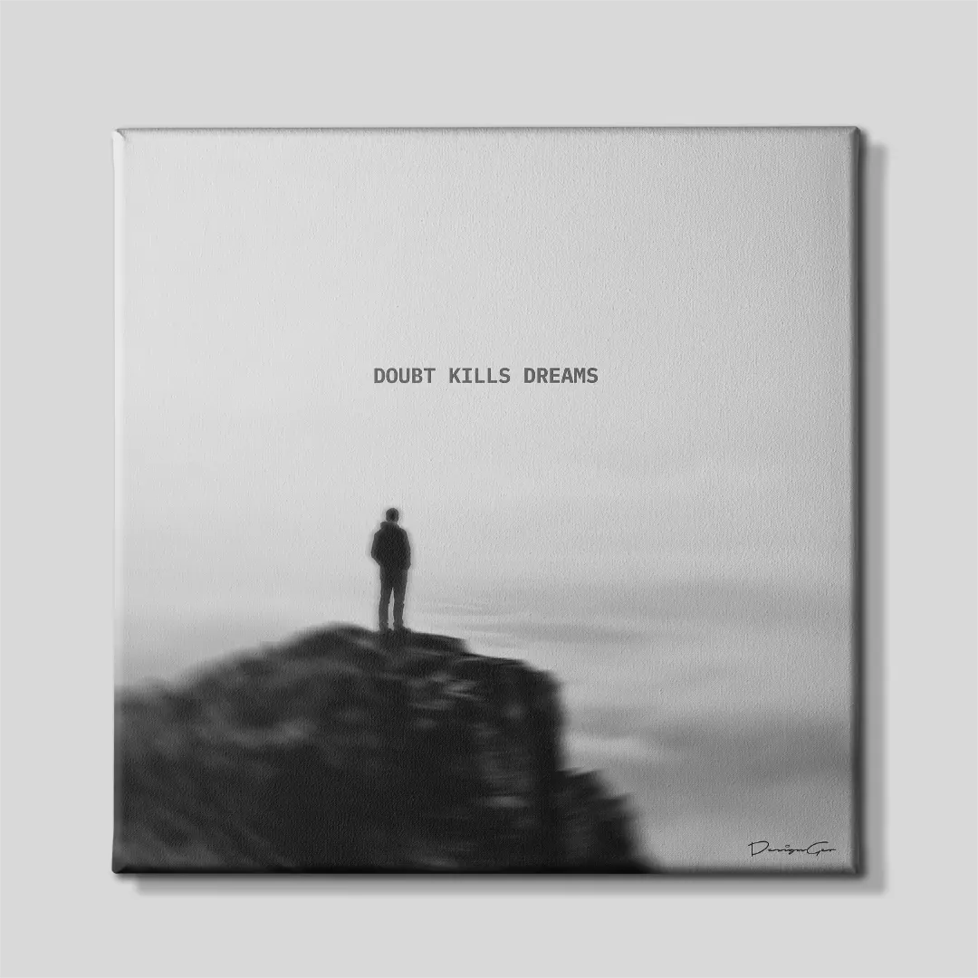 Black and white square canvas art featuring a person silhouette standing on a cliff edge overlooking foggy horizon with quote Doubt Kills Dreams 0.75 inch thin wrap