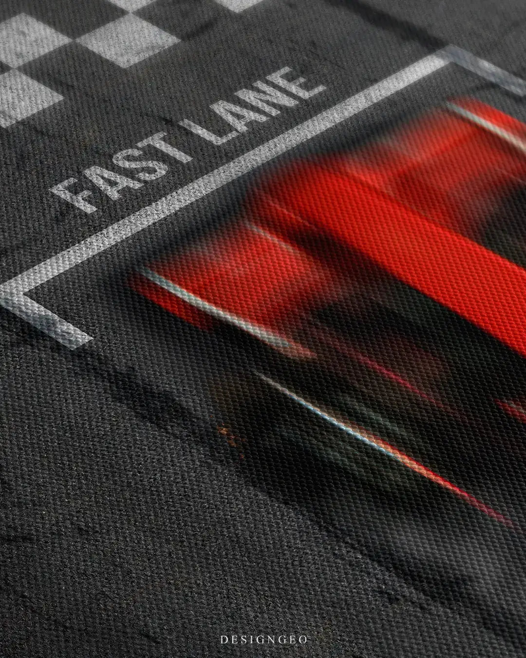 Close-up of modern motorsport wall art featuring a single-seater race car in motion blur over a textured grey racetrack background