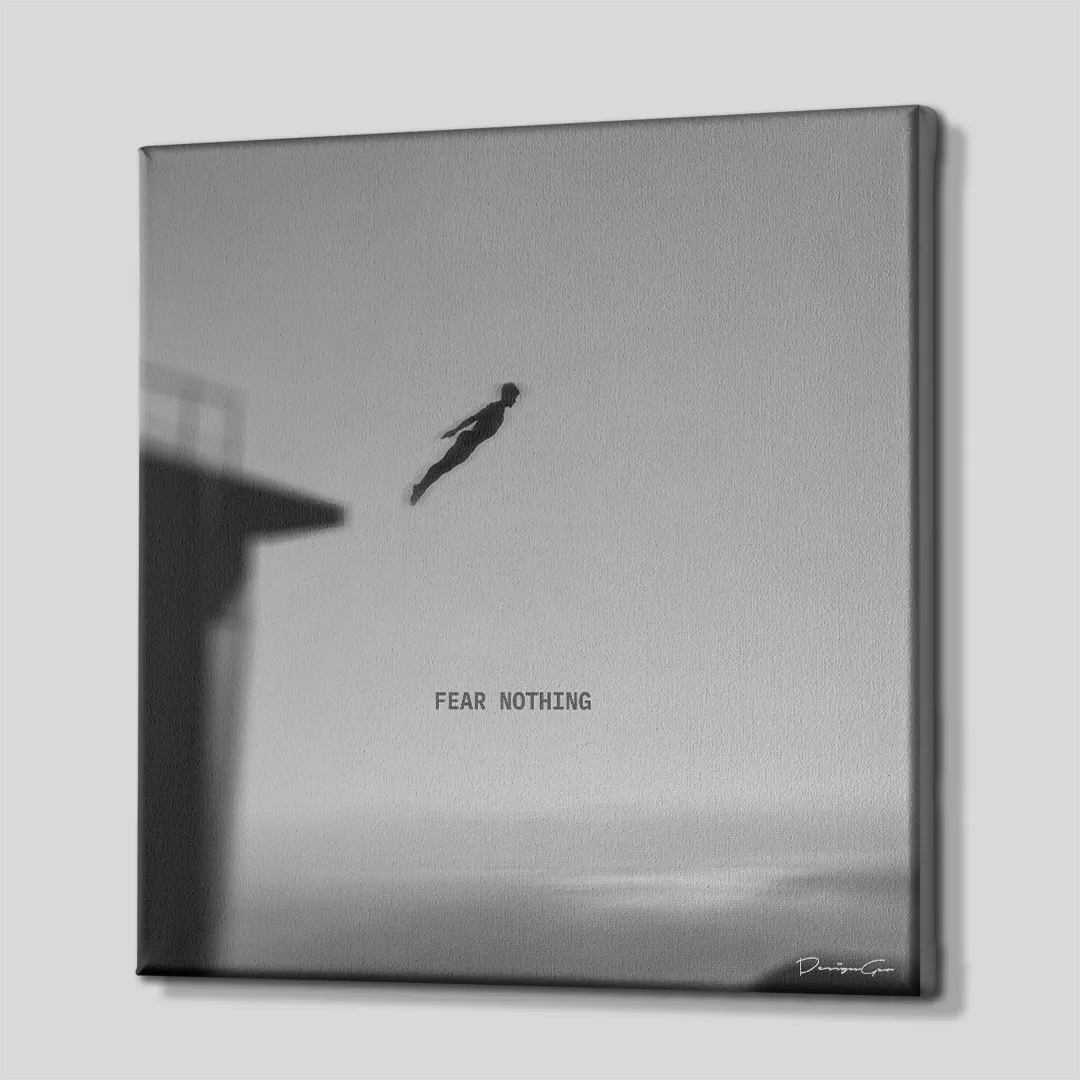 Side perspective view of black and white square canvas art showing cliff diving artwork with dark gallery wrapped edge 0.75 inch thin wrap