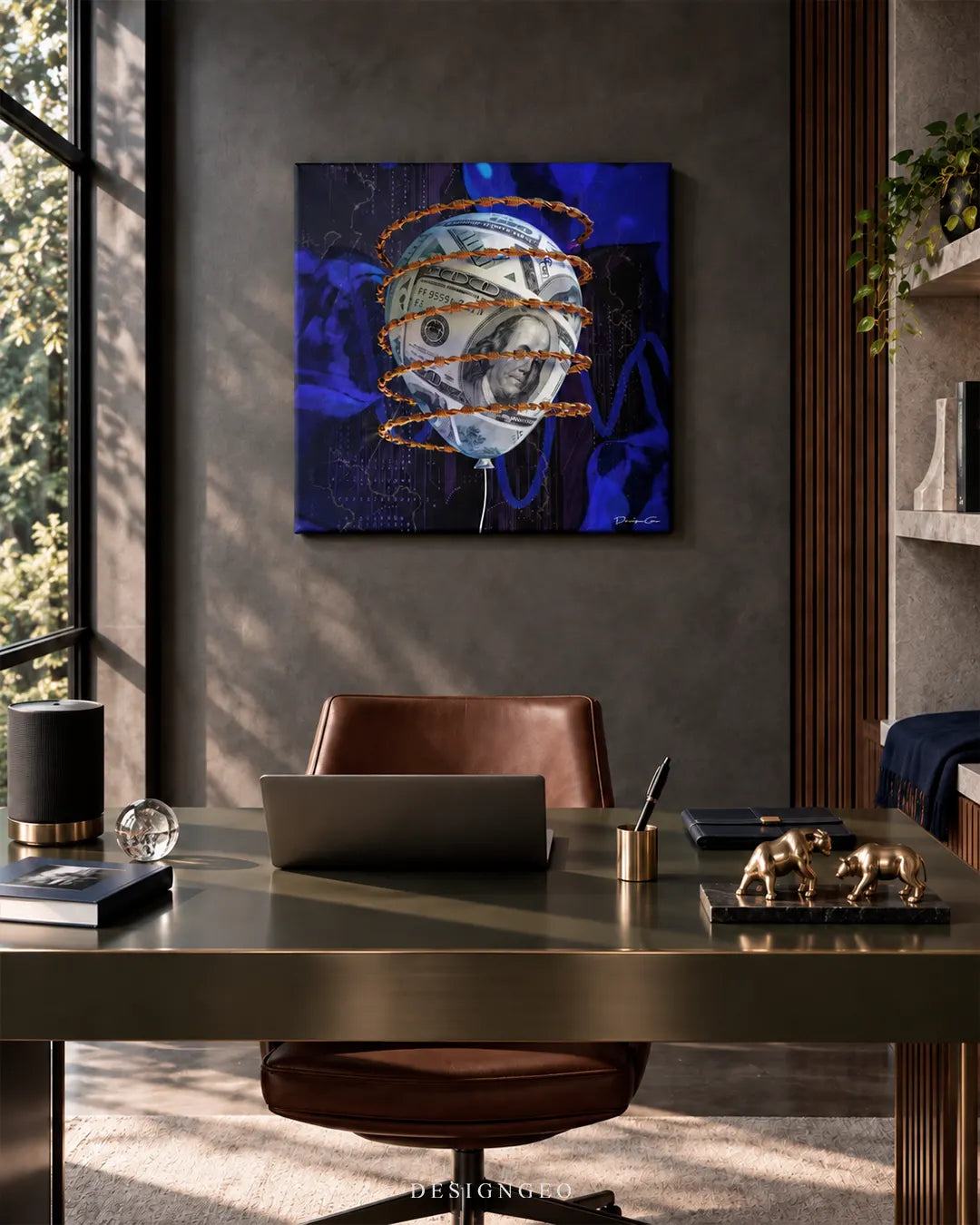 Square dark blue canvas print featuring a US dollar bill balloon wrapped in golden barbed wire mounted on a dark grey office wall above an executive desk with a brown leather chair