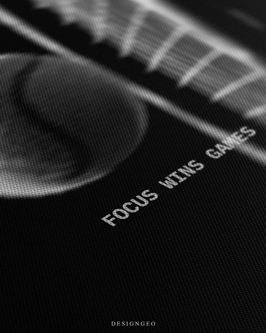 Angled detailed macro texture of black woven canvas print showing tennis ball hitting racket strings with Focus Wins Games quote