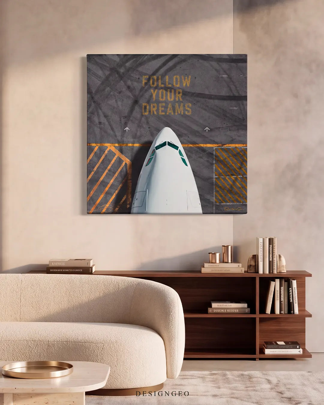 Modern executive room interior with beige walls, displaying the square "FOLLOW YOUR DREAMS" airplane canvas art mounted above a dark wood credenza and a light cream sofa