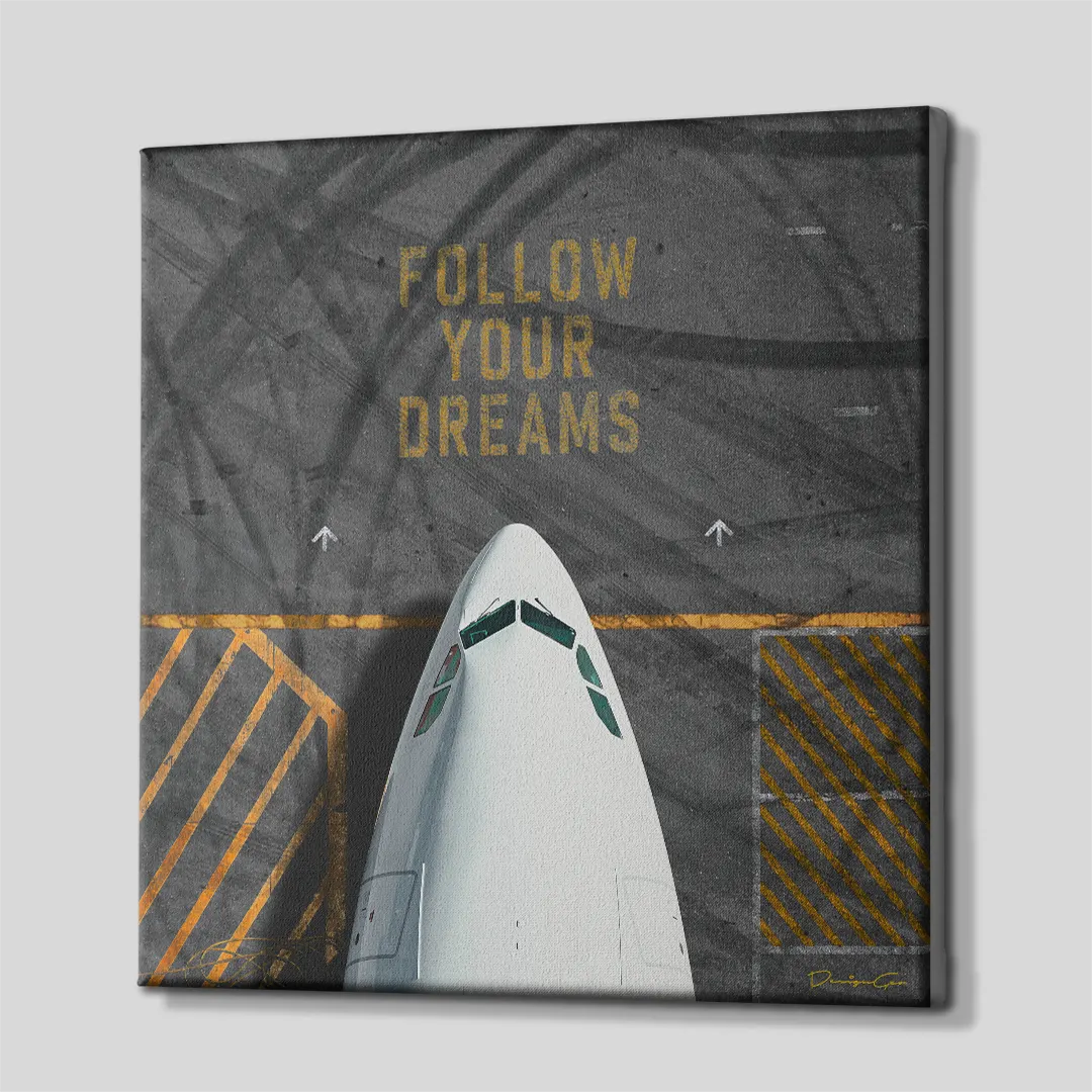 Three-quarter side profile of the square "FOLLOW YOUR DREAMS" airplane canvas print, showing continuous gallery-wrapped asphalt edges mounted on a solid wooden frame
