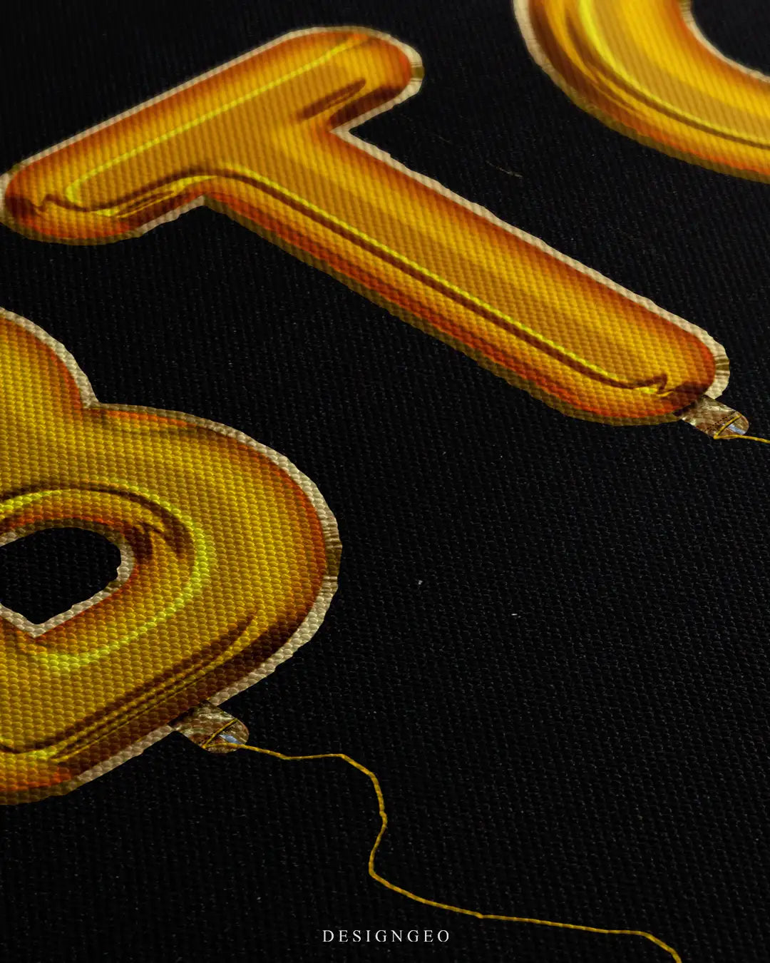 Angled macro view of a luxury cryptocurrency art print, showing the reflective golden finish and realistic crinkle texture of foil balloon strings on black canvas