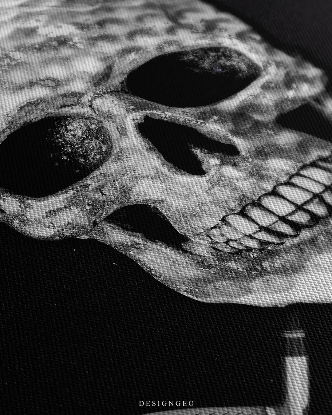 Angled close-up detail shot highlighting the indented golf ball dimples, skull eye sockets, and fine woven canvas fabric grain