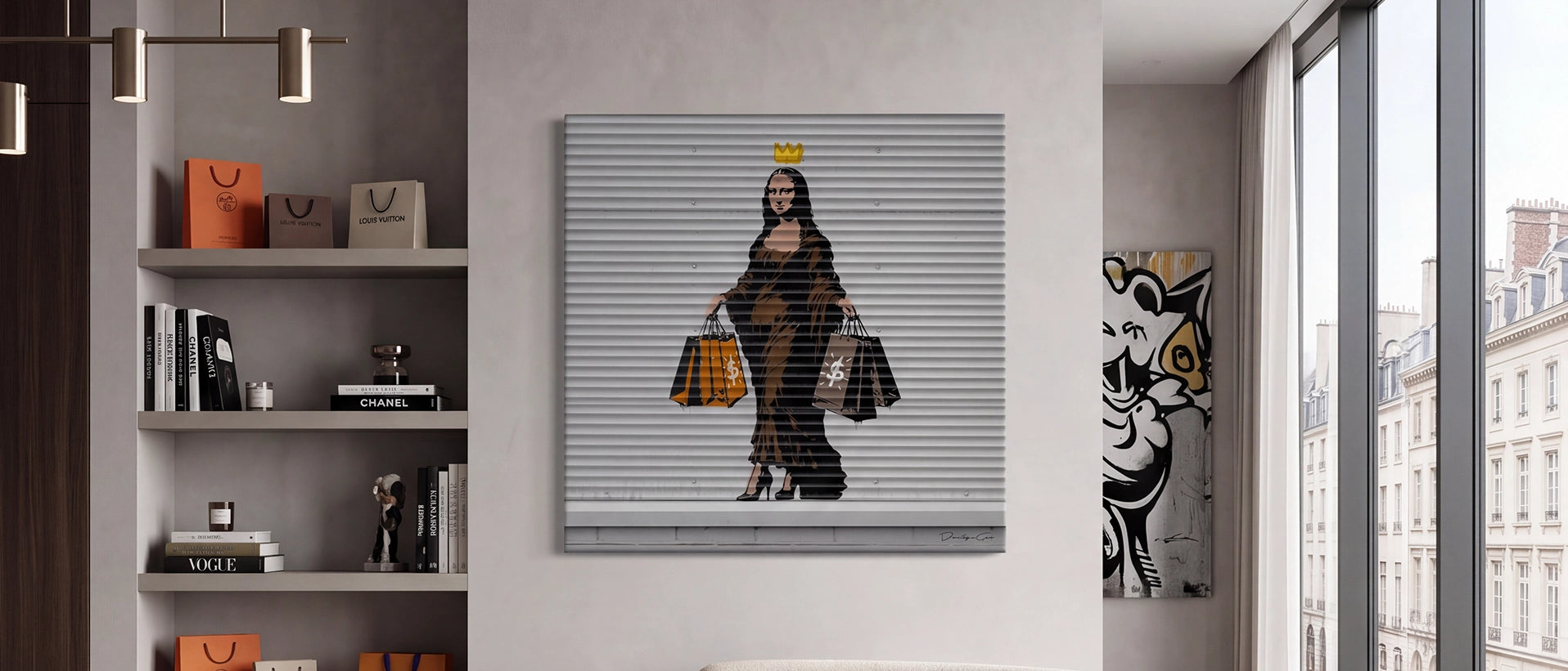 Wide landscape view of a modern luxury living room interior featuring the square "Shopping Queen" Mona Lisa graffiti canvas print on a neutral wall, next to built-in shelves with luxury fashion books and a bright window overlooking classic city buildings