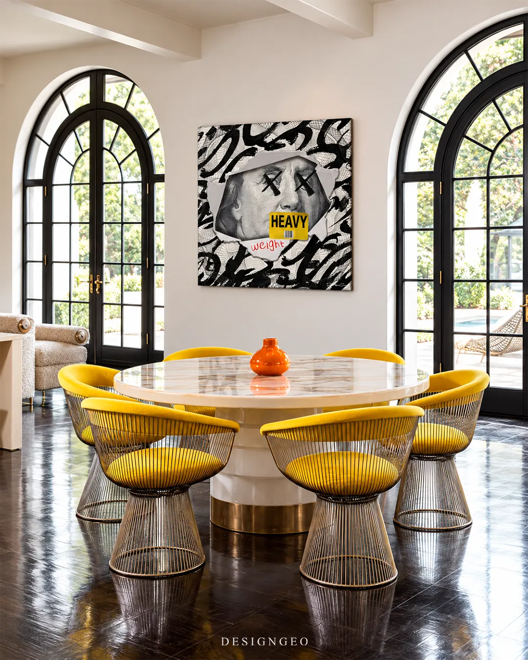 Silenced Benjamin Franklin graffiti square canvas print featuring ripped paper design mounted on a white wall in a luxury dining room above a marble table with yellow chairs