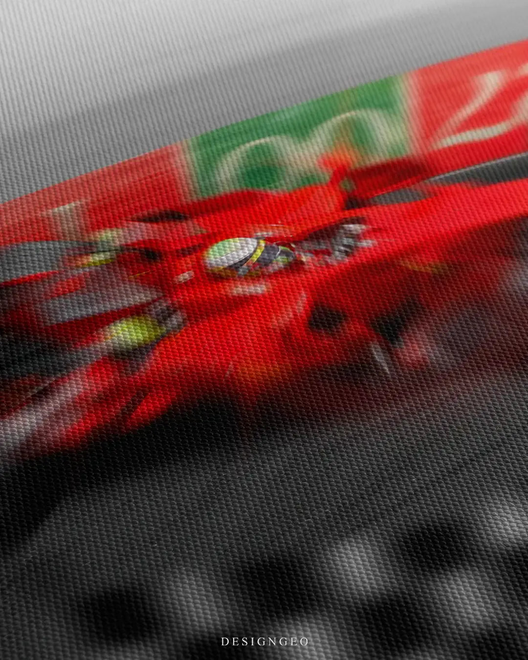 Close-up of modern luxury wall art featuring a blurred red single-seater race car accelerating through a curved track section designed as a Monte Carlo style roulette wheel on a grey canvas background