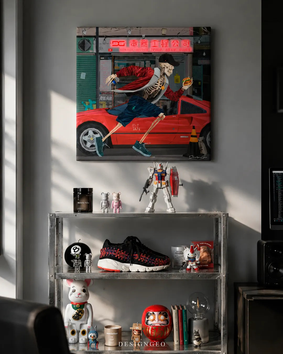 Square Hong Kong Rush skeleton canvas print mounted on a grey wall above an industrial metal shelf displaying a Gundam action figure, Bearbrick toys, and sneakers