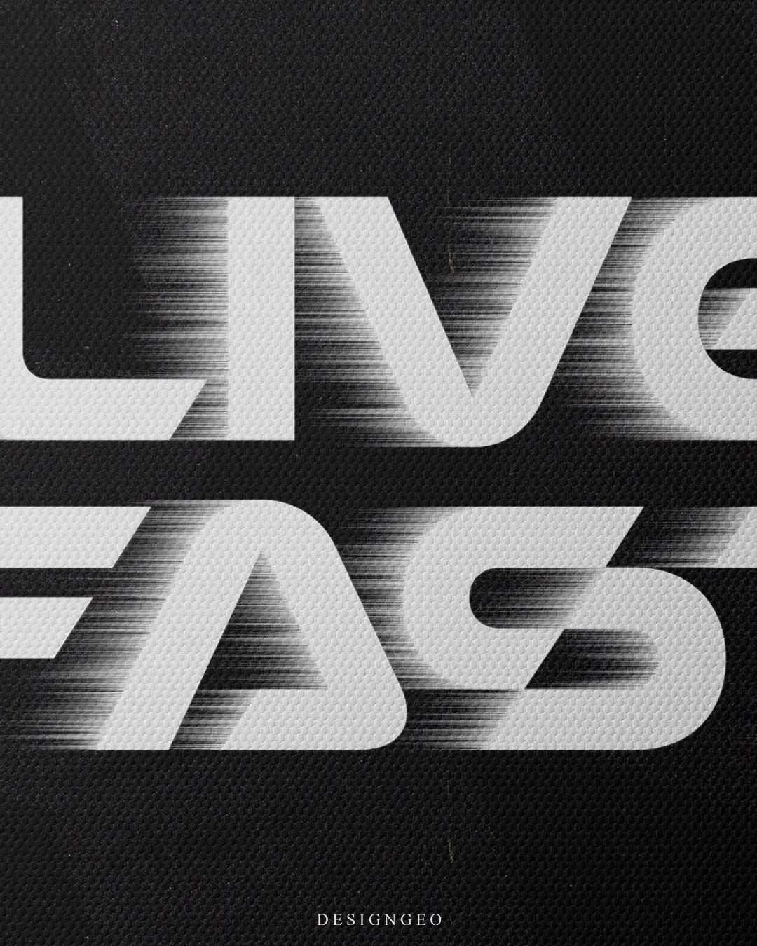Medium shot showing white LIVE FAST typography with dynamic speed trail effects printed on a dark canvas background