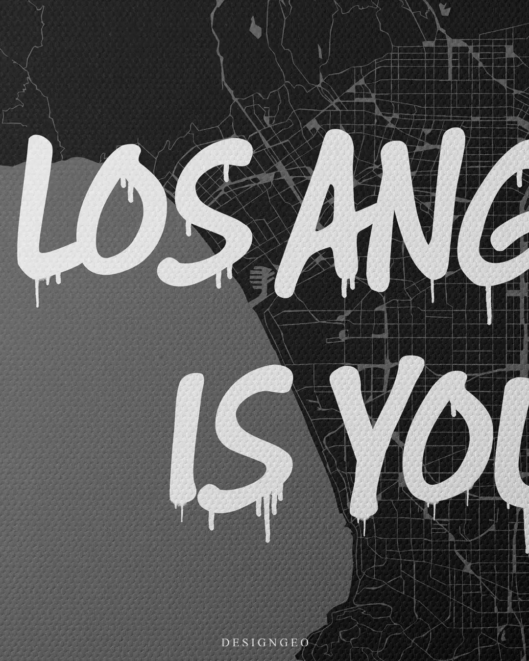 Detailed view of the "Los Angeles is Yours" art, showcasing the high-contrast white spray-paint typography layered over the professional cartographic layout of LA