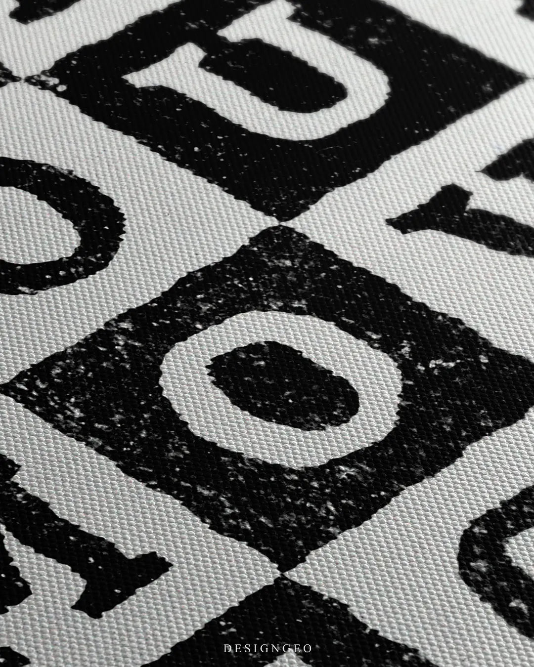 Angled close-up detail shot showing the grainy stamp texture on the black chess squares and the fine woven canvas fabric finish
