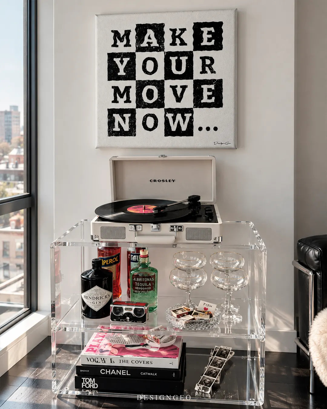 Make Your Move Now black text on chessboard grid square canvas wall art displayed on a white wall above a clear acrylic bar cart with record player