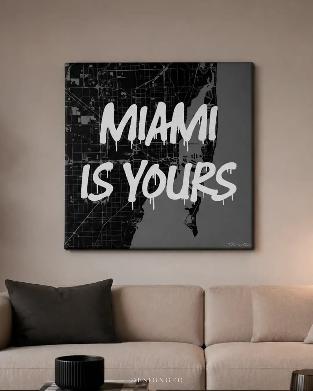 Modern living room interior featuring the "Miami is Yours" square canvas art above a sofa, symbolizing ambition and financial achievement for home office decor