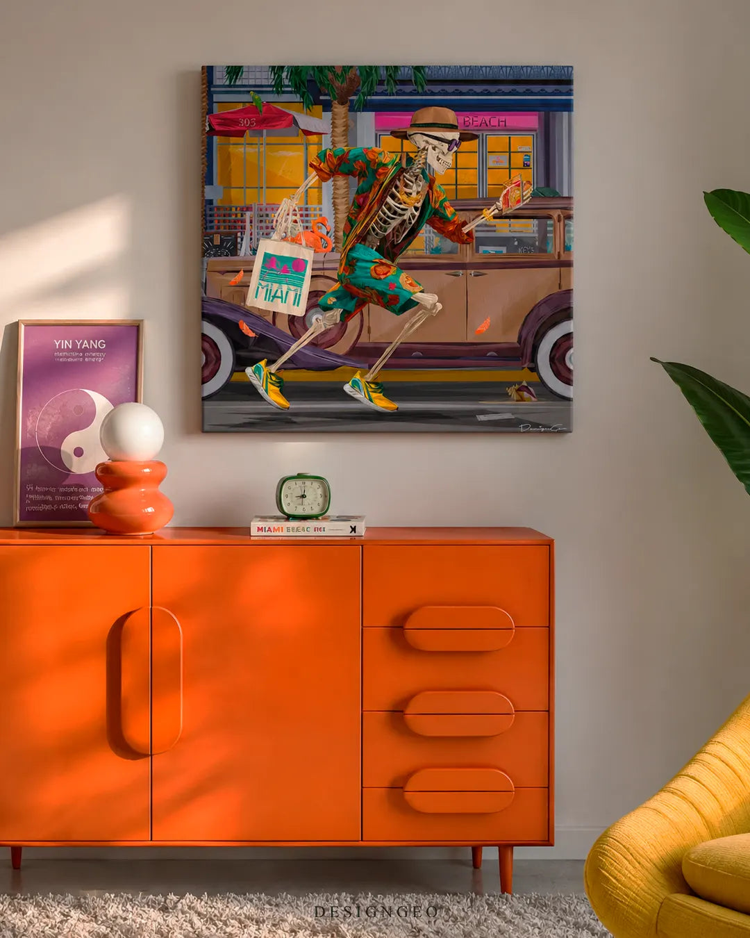 Square running skeleton canvas print mounted on a neutral wall above a bright orange mid-century credenza, green retro clock, orange lamp, and purple Yin Yang poster