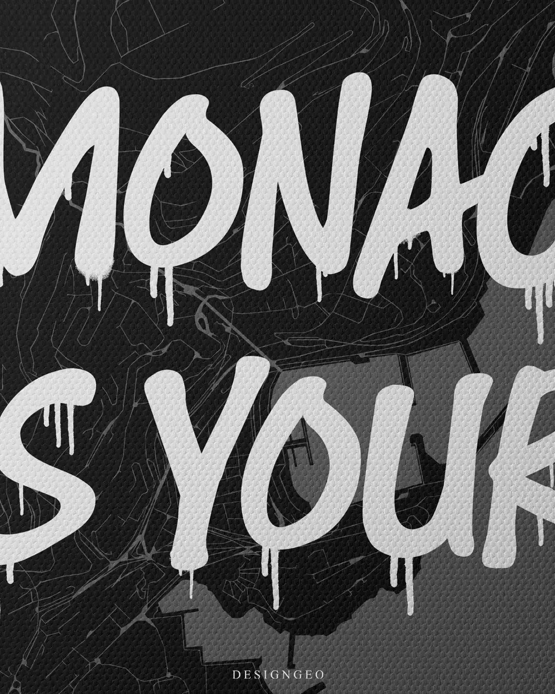 Close-up of Monte Carlo luxury style wall art featuring a detailed Monaco city map layout with the motivational phrase "Monaco is Yours" in bold white graffiti typography on a dark background