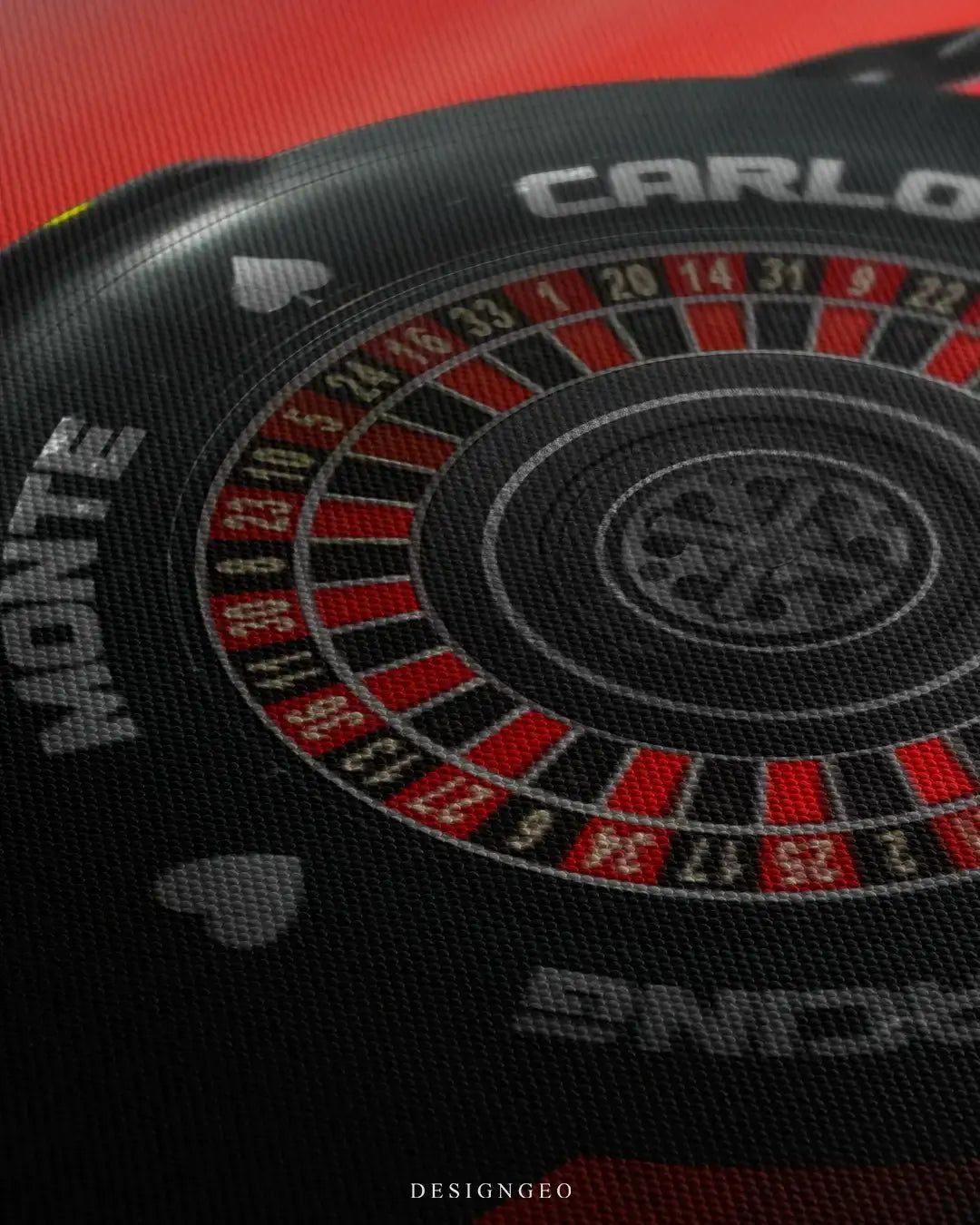Close-up of luxury motorsport wall art featuring the front nose of a race car with a roulette wheel tire design on a minimalist vibrant red background