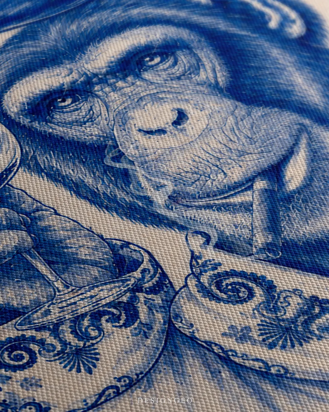 Angled close-up shot showing the detailed woven canvas texture, focusing on the cobalt blue ornamental paisley pattern on the robe collar and the stemware glass held by the chimpanzee