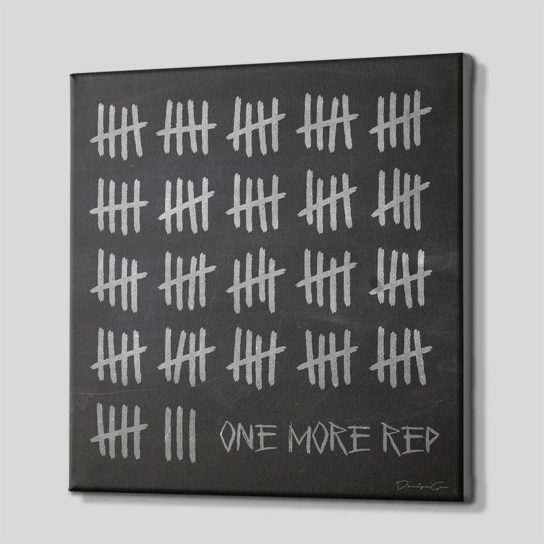 Three-quarter side angle of the One More Rep tally marks motivational canvas wall art showing gallery-wrapped black edges mounted on a wooden frame