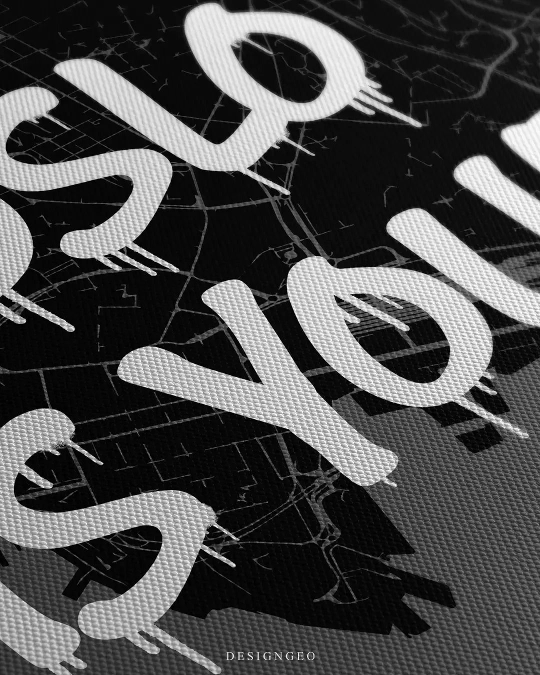 Angled macro close-up of Oslo urban city map wall art highlighting the textured canvas weave and bold white graffiti font with realistic paint drips on a dark background